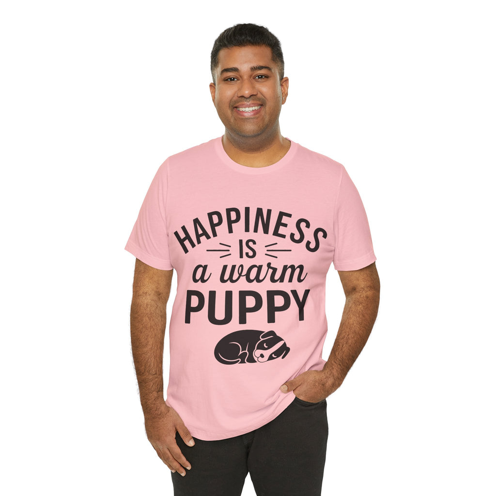 Man wearing a pink t-shirt with 'Happiness is a warm puppy' text and graphic on a white background