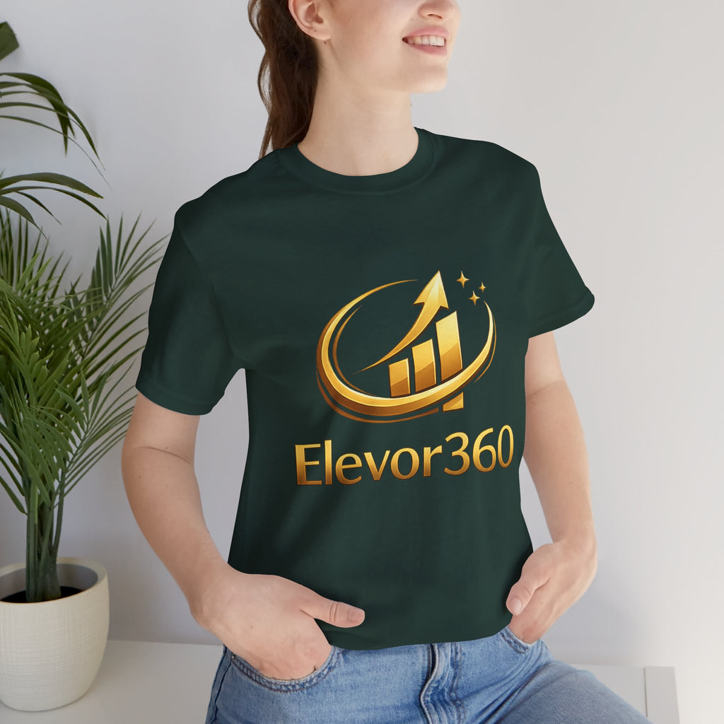 Person wearing a dark green t-shirt with 'Elevor360' logo indoors.
