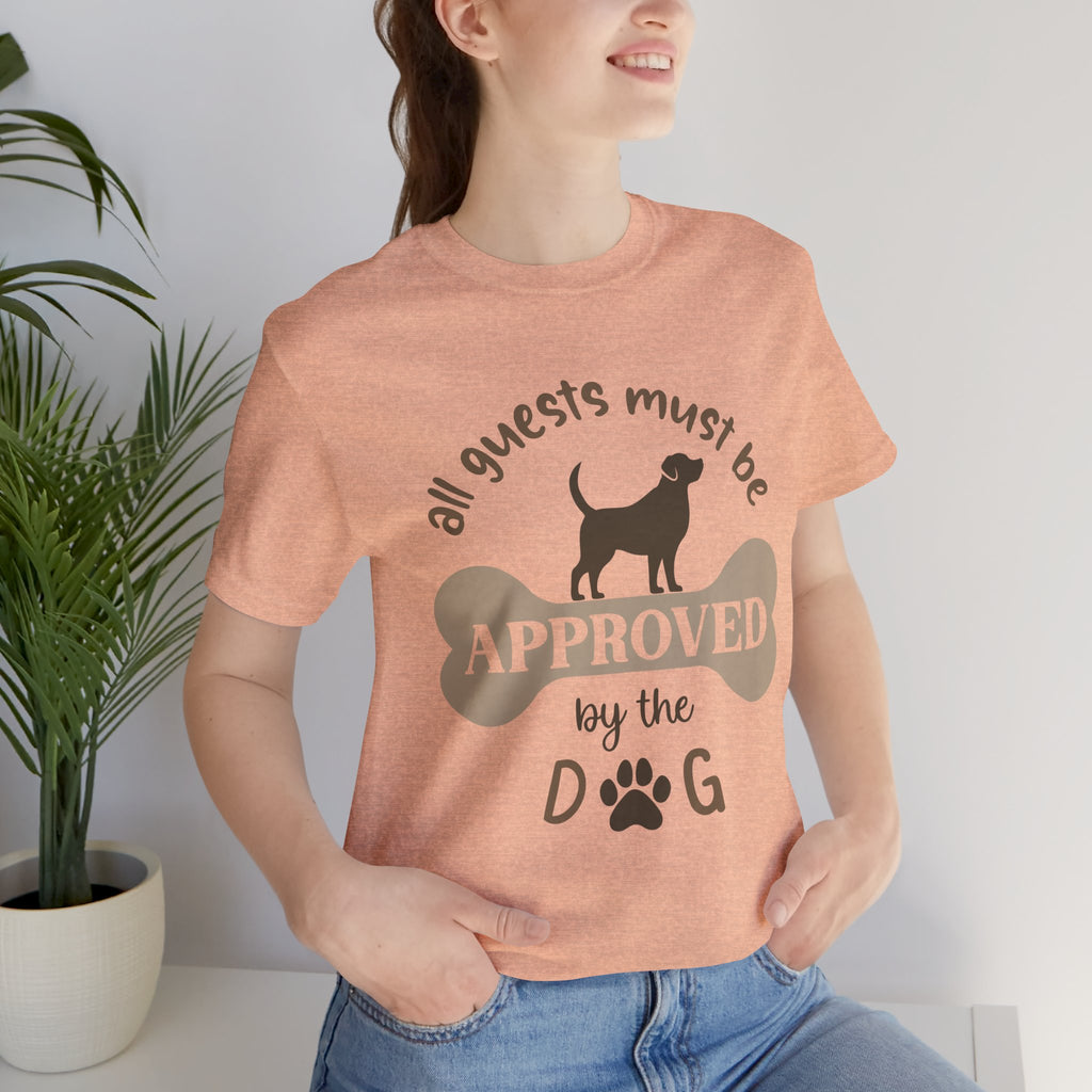 Person wearing a t-shirt with a dog-themed graphic and text.