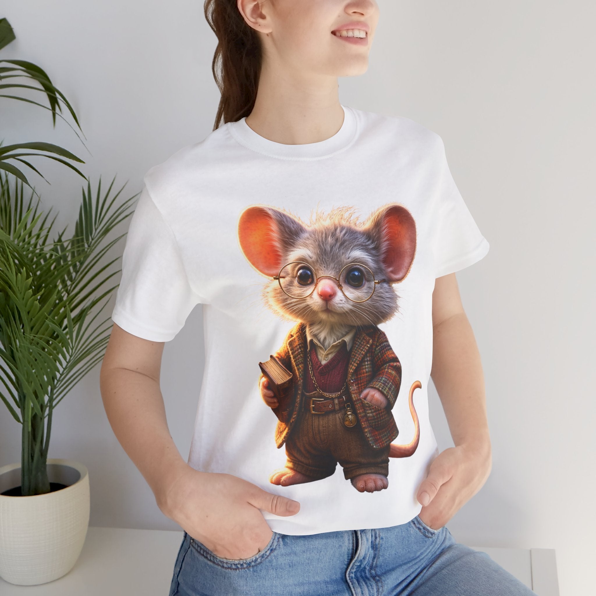 Person wearing a white t-shirt with a cartoon mouse design, standing indoors next to a plant.