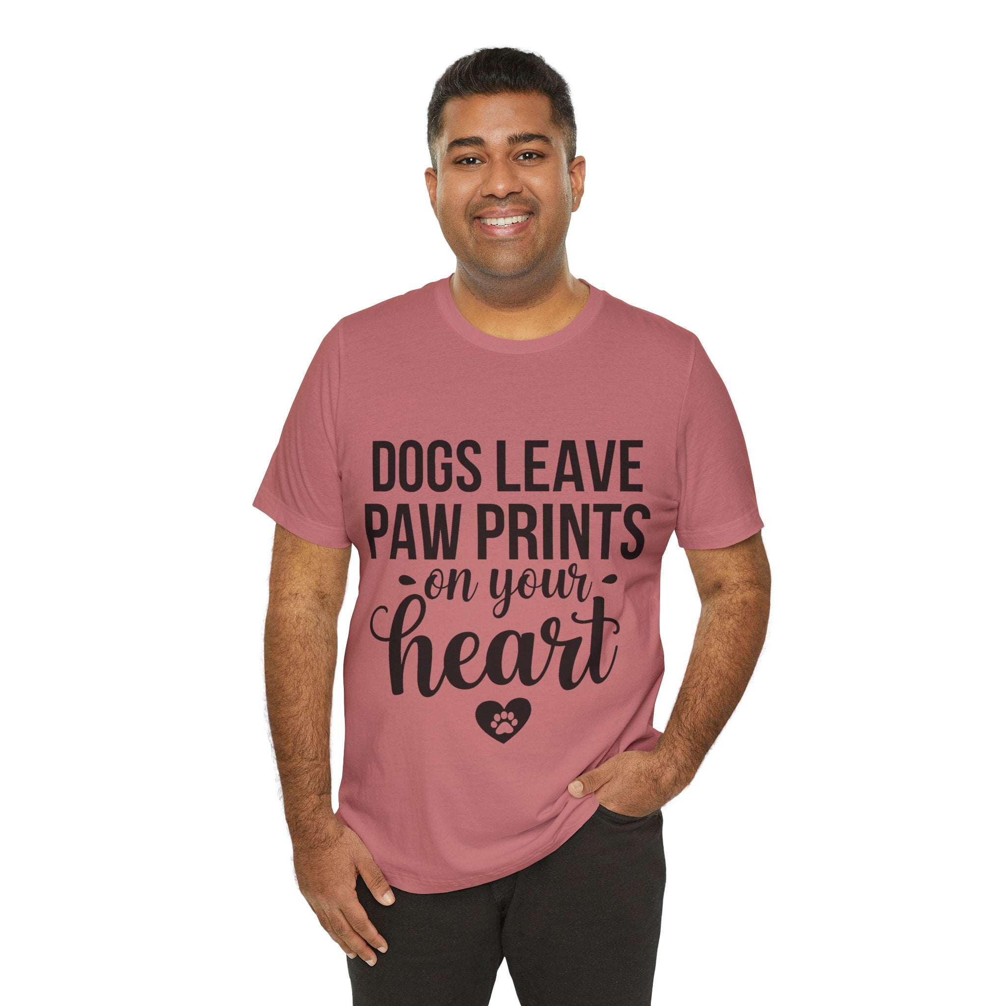 Man wearing a pink t-shirt with text and a heart graphic on a white background