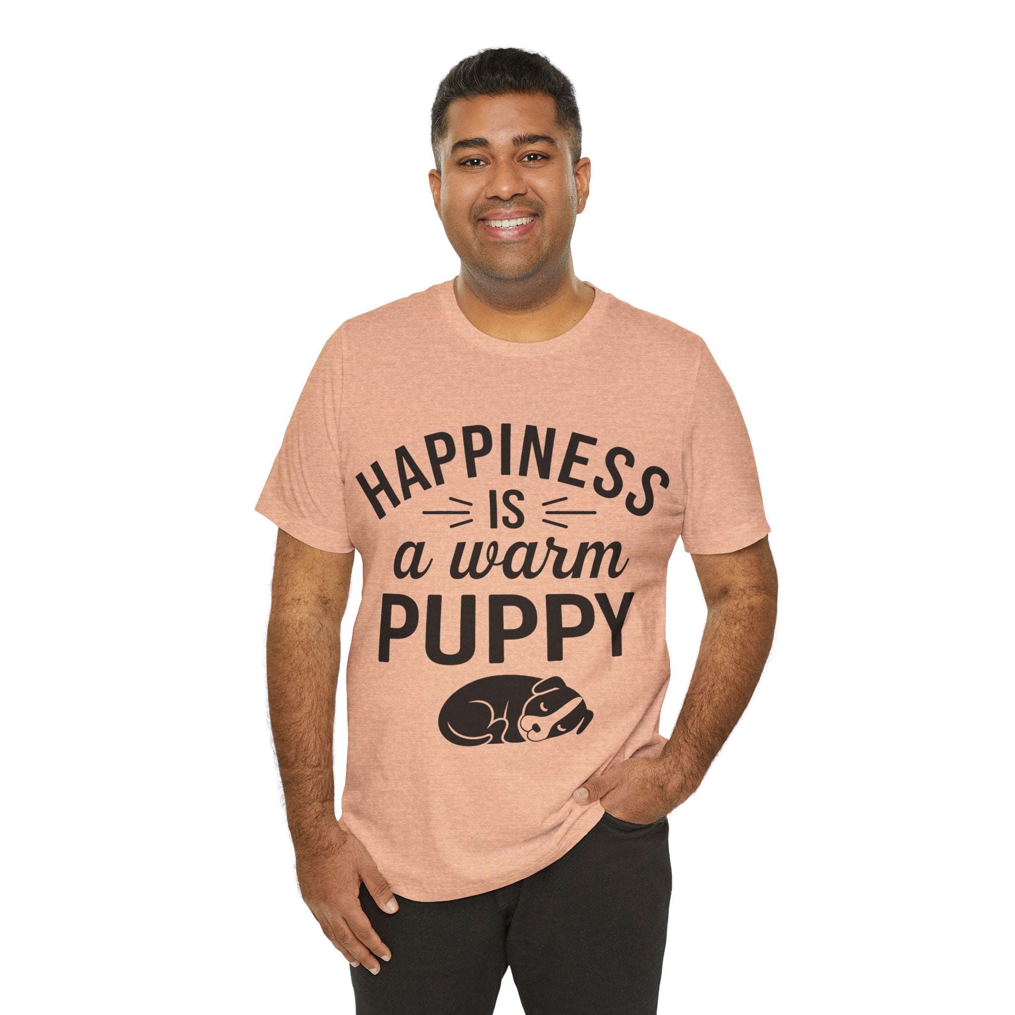 Man wearing a pink t-shirt with 'Happiness is a warm puppy' text and graphic on a white background
