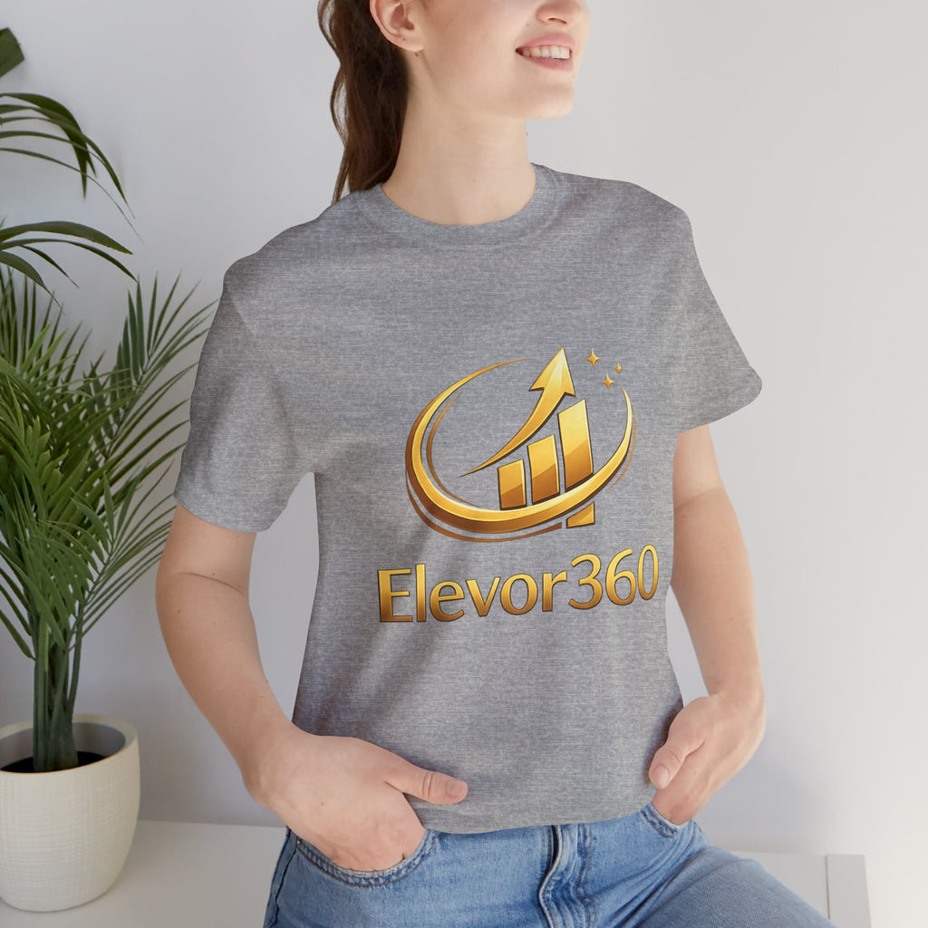 Person wearing a gray t-shirt with 'Elevor360' logo in gold