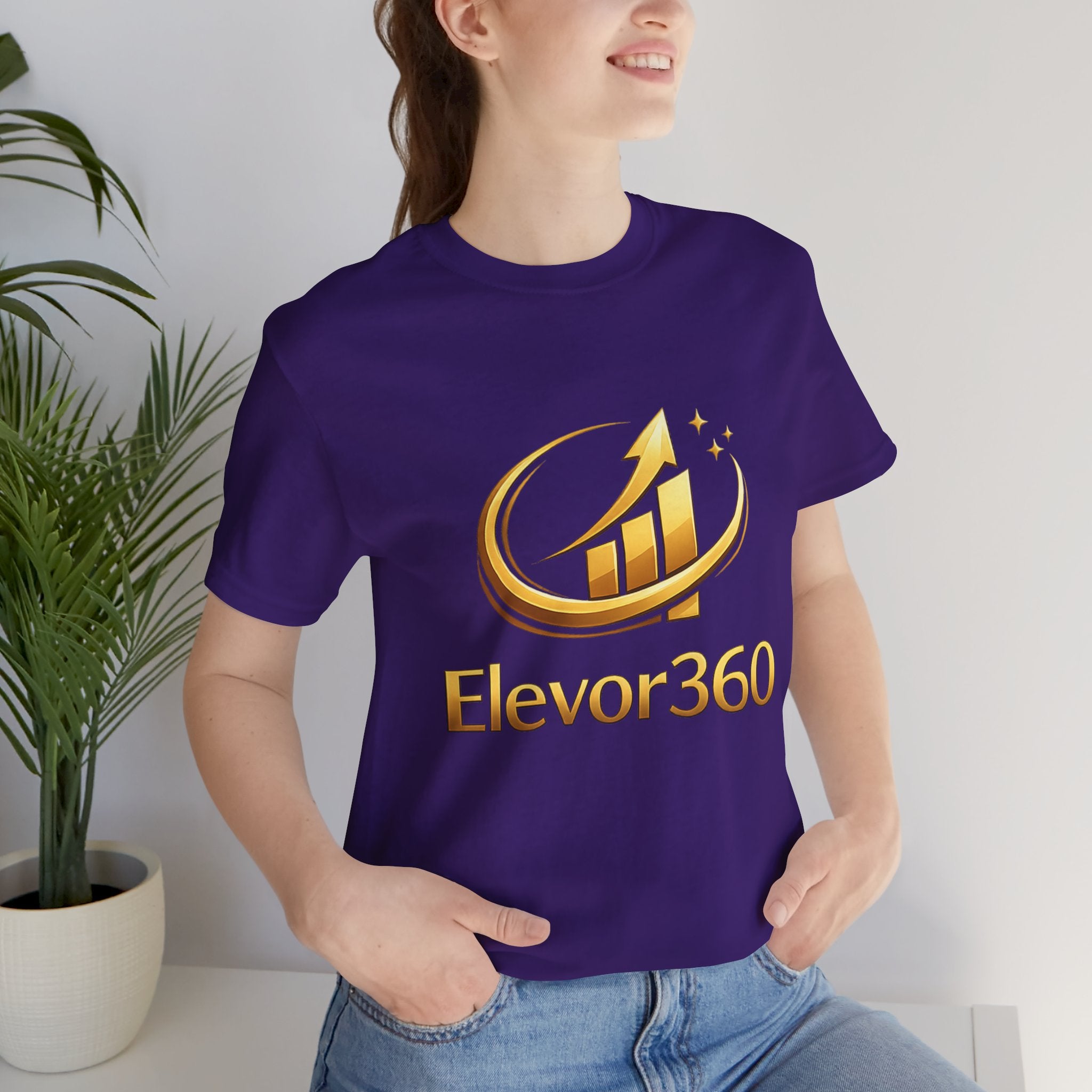 Person wearing a black t-shirt with Elevor360 logo in a casual setting