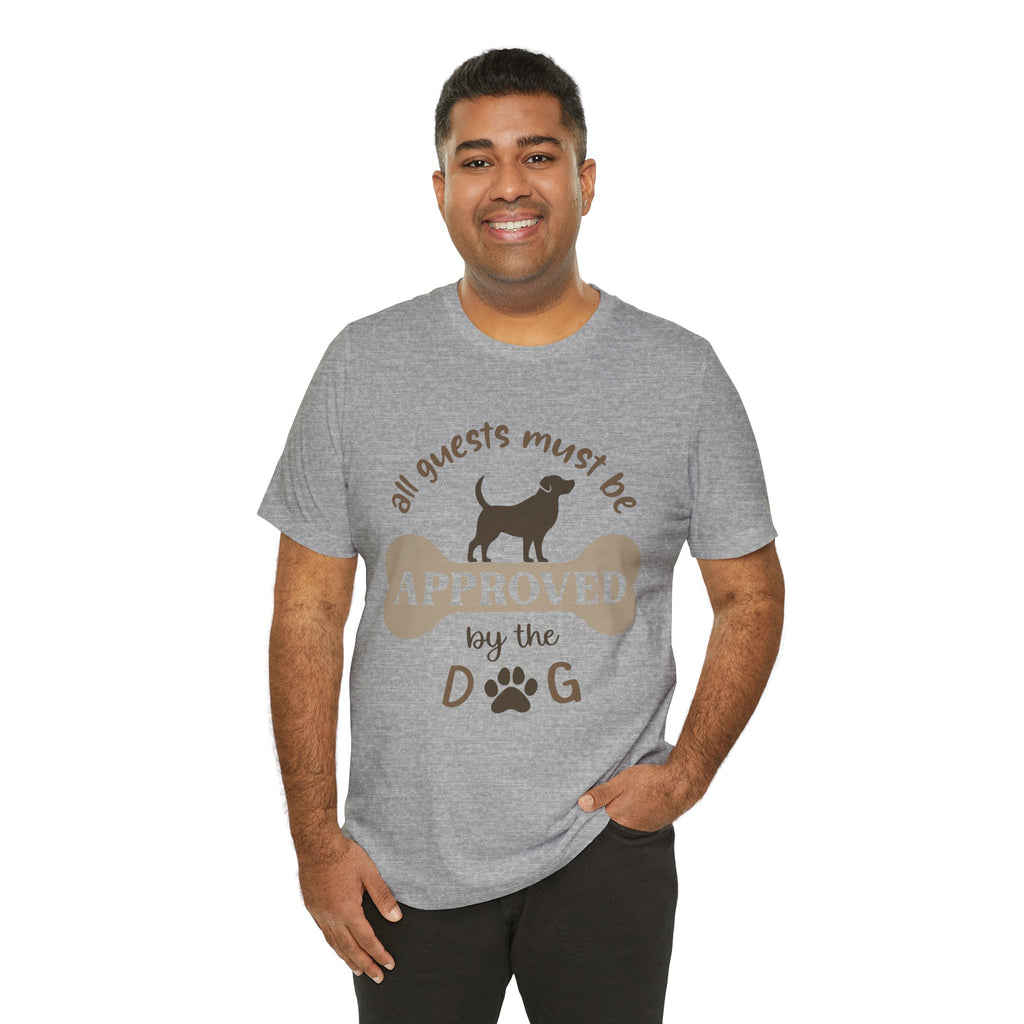 Man wearing a gray t-shirt with a dog-themed graphic and text on a white background