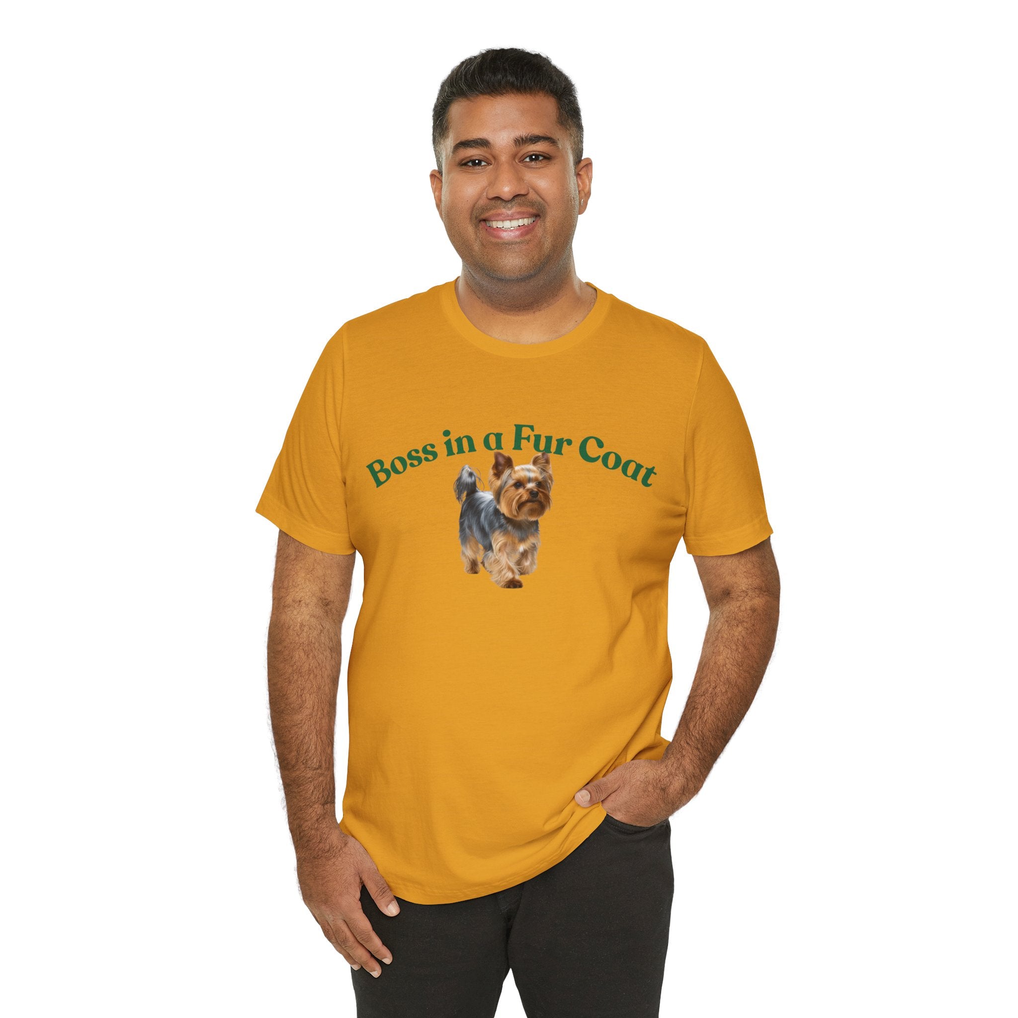 Man wearing a mustard yellow t-shirt with a dog graphic and text on a white background
