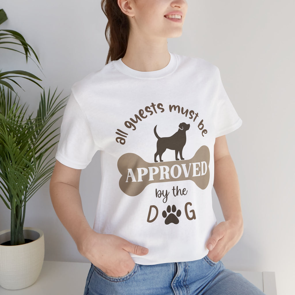 Person wearing a white t-shirt with a humorous dog-themed graphic and text.