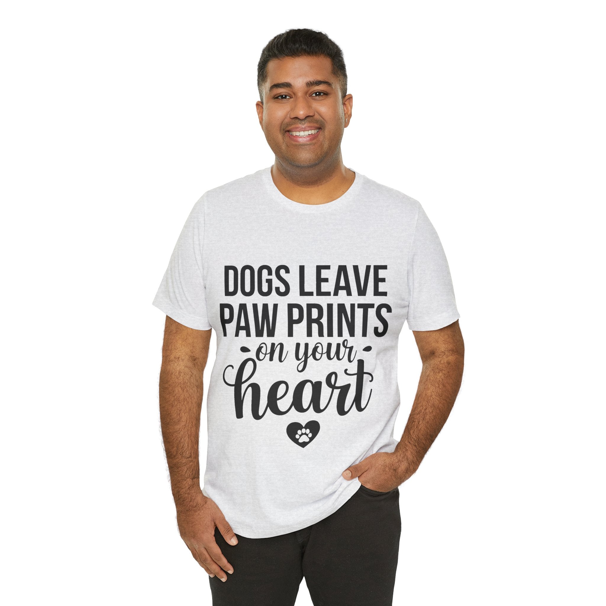 Man wearing a white t-shirt with text 'Dogs leave paw prints on your heart' on a white background