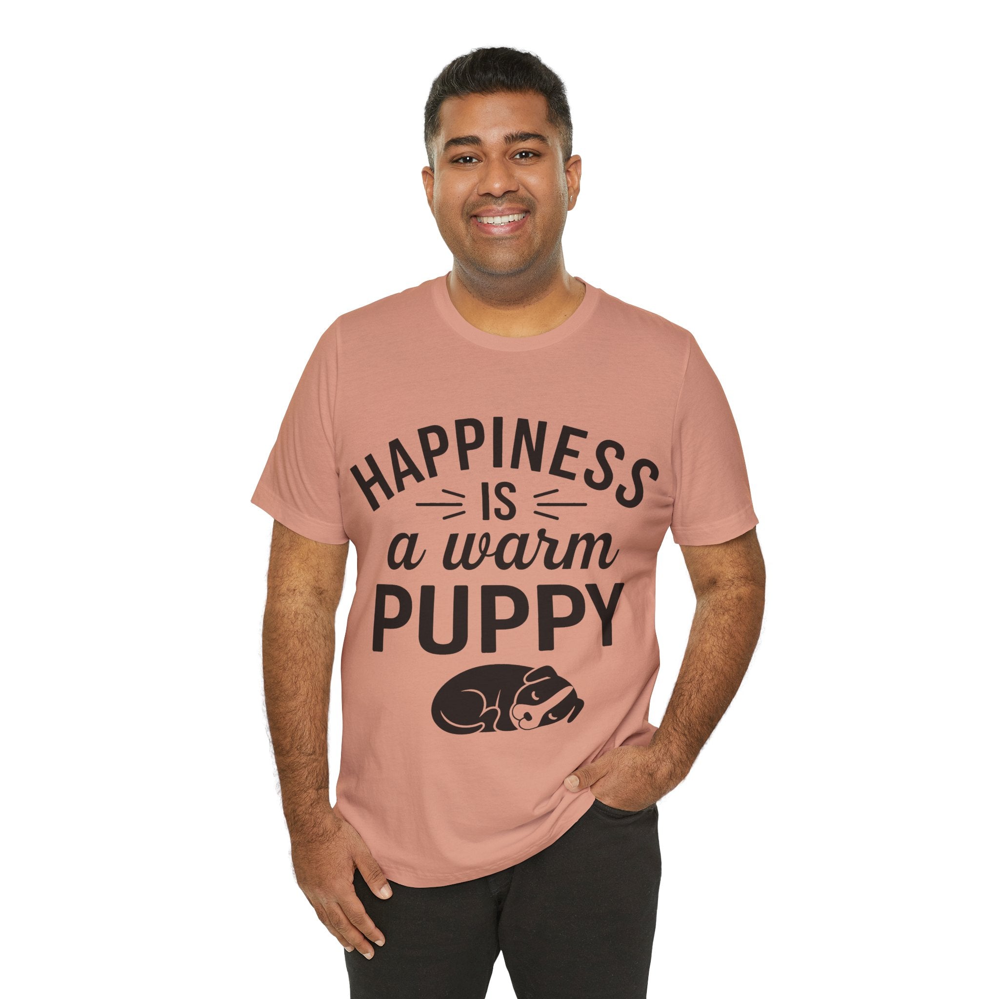 Man wearing a pink t-shirt with 'Happiness is a warm puppy' text and graphic on a white background