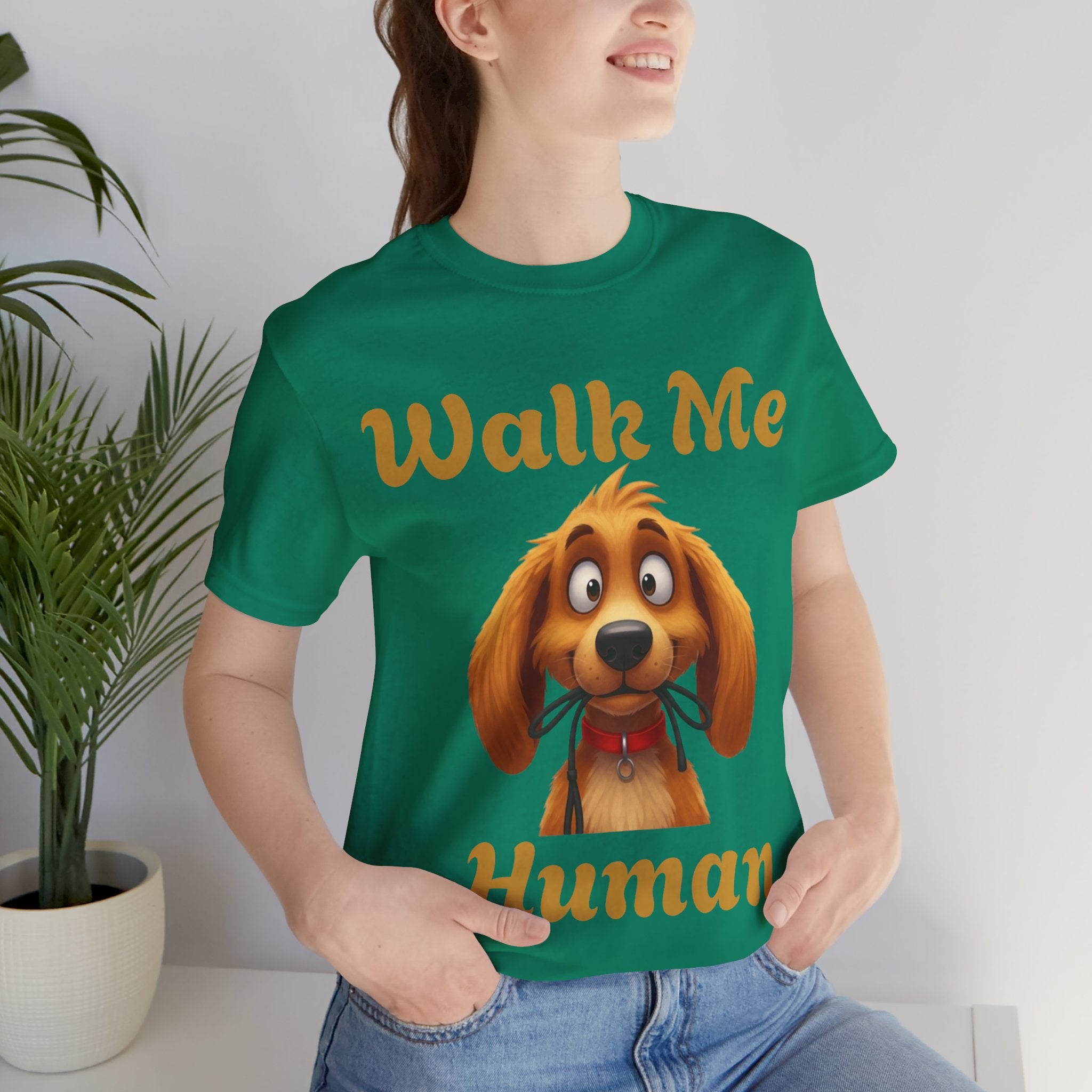 Elevor360 - Person wearing a green t-shirt with a dog graphic and text, sitting indoors.