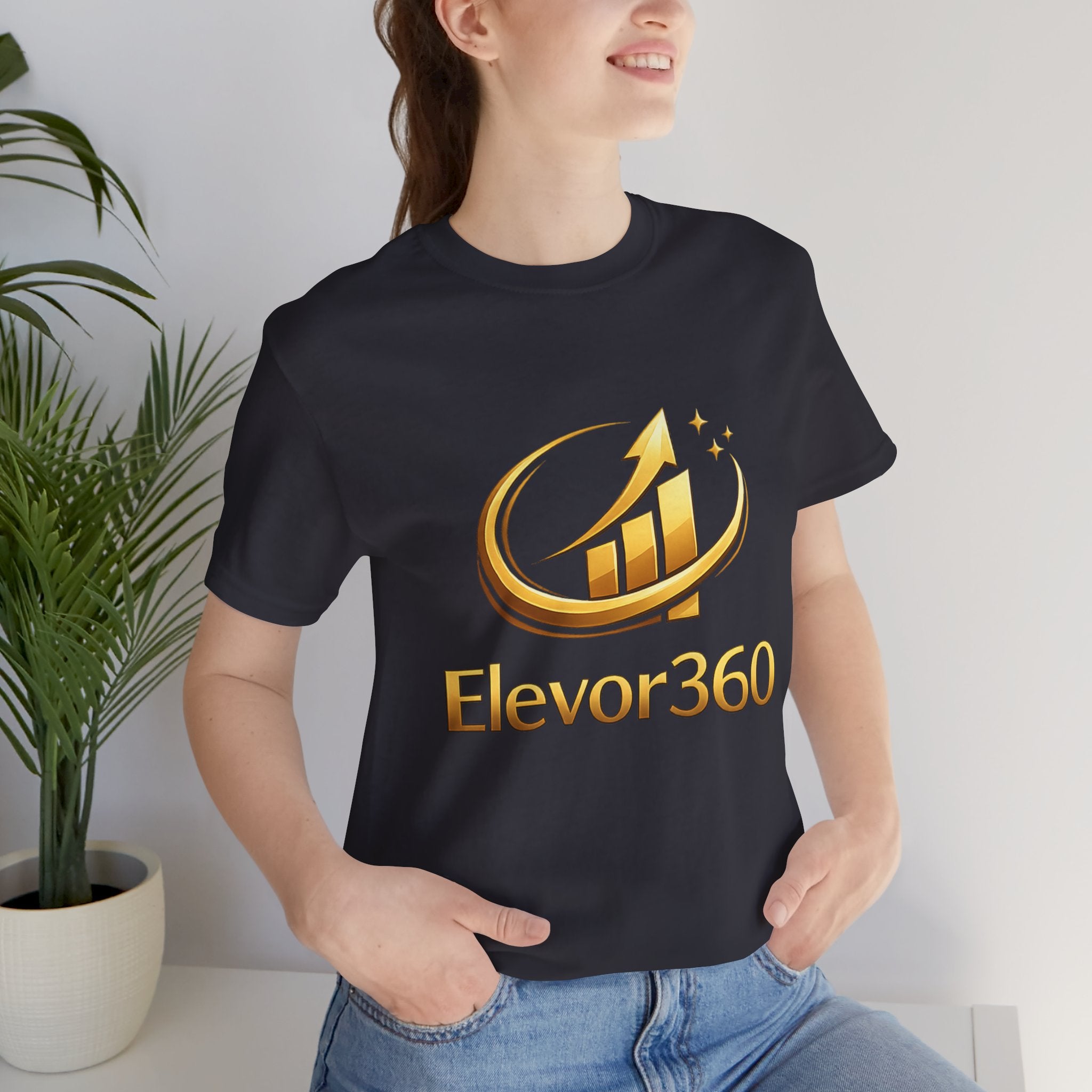 Person wearing a black t-shirt with Elevor360 logo in a casual setting