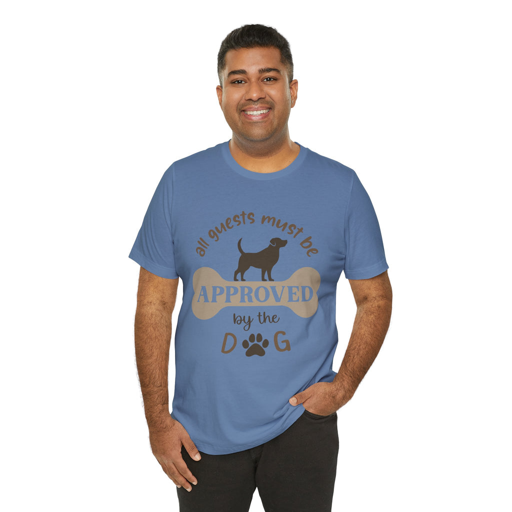 Man wearing a blue t-shirt with a dog-themed graphic and text.
