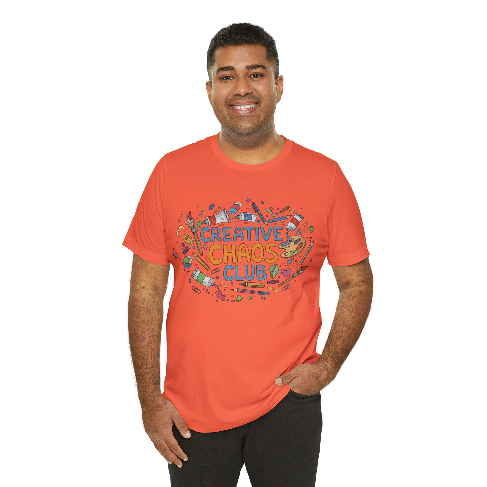 Elevor360 - Man wearing an orange t-shirt with 'Creative Chaos Club' design on a white background